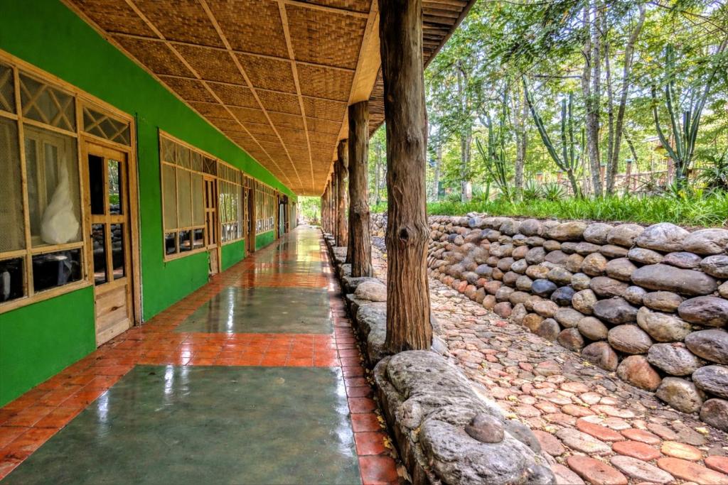 an empty hallway of a building with water in it at Voyager's Center in Kikorongo