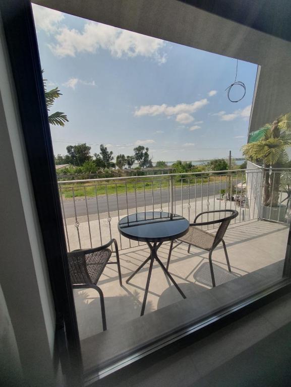 a view of a patio with a table and chairs at Constantin Rooms in Eforie Nord