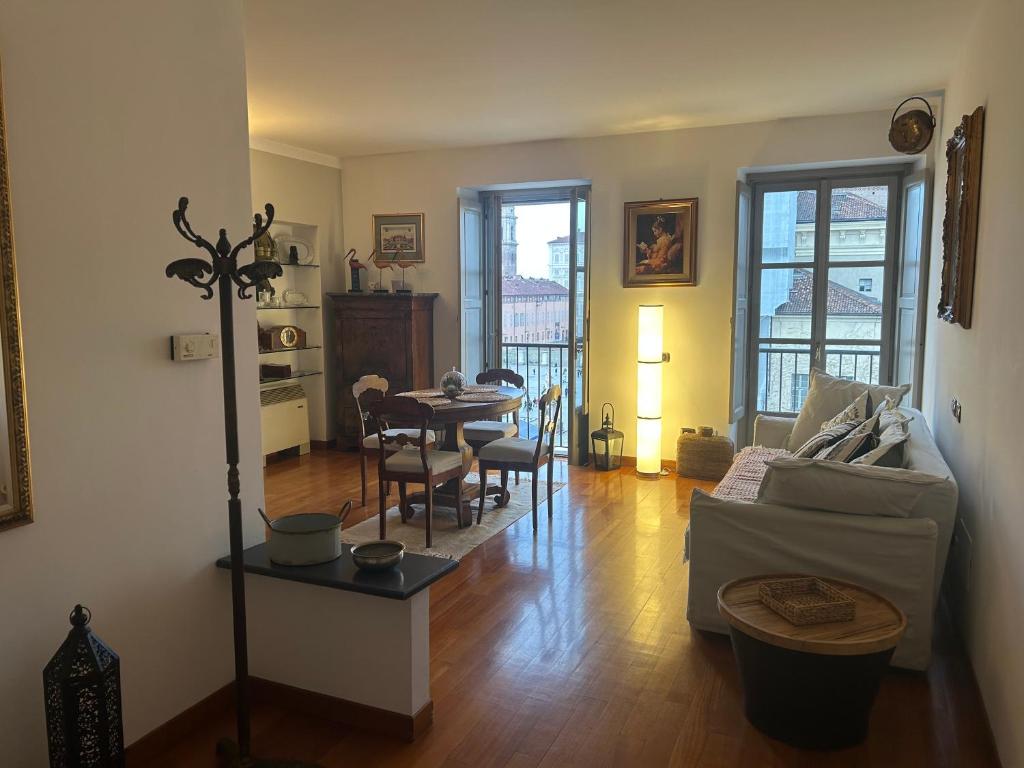 a living room with a couch and a table at Il re di Torino in Turin