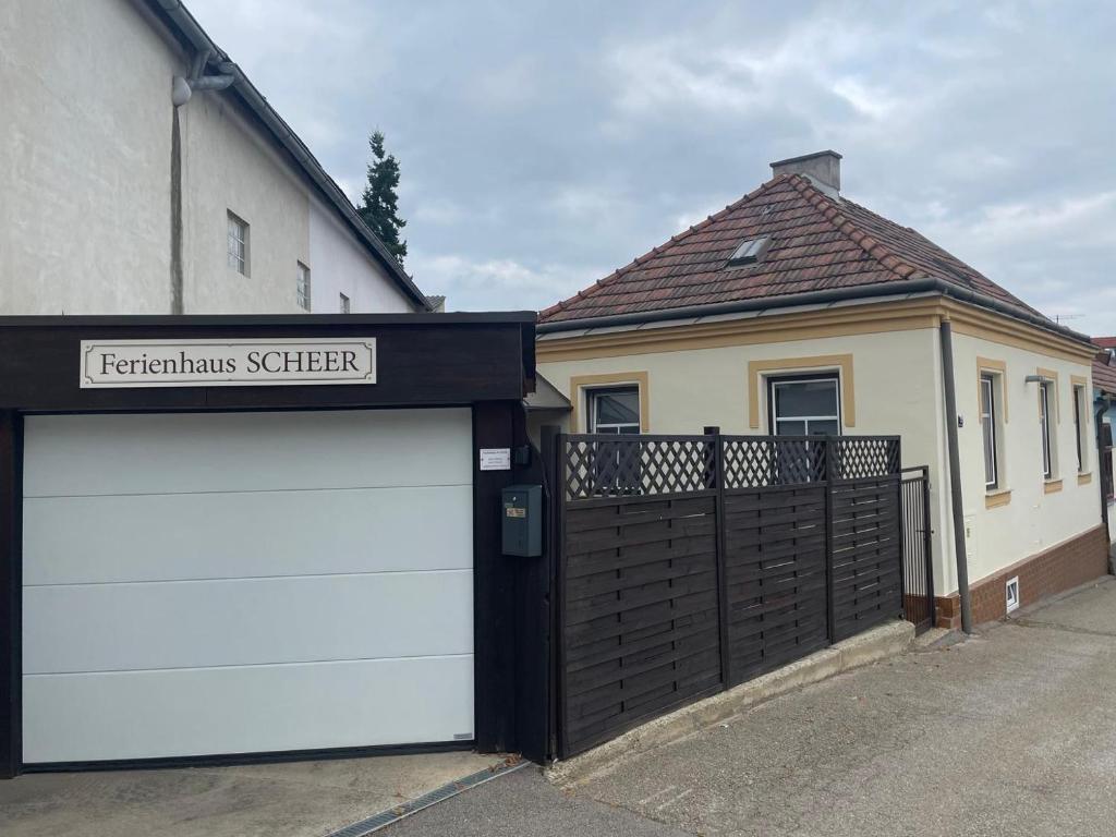 a house with two garage doors in front of it at Ferienhaus Scheer in Retz