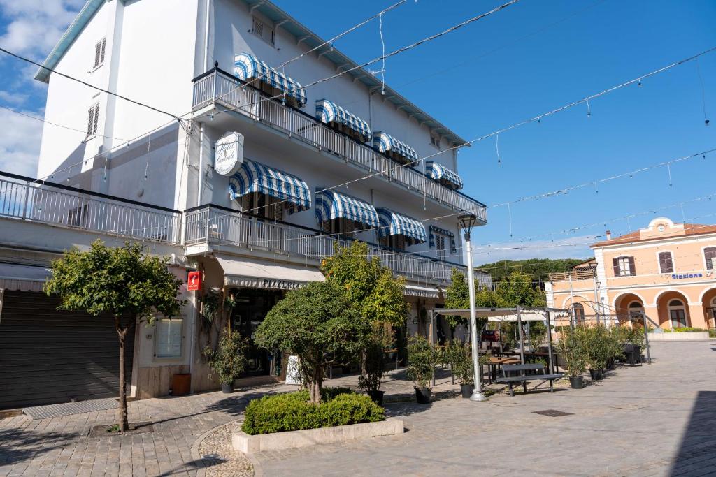 a building with balconies on a city street at Hotel Centrale in Pineto
