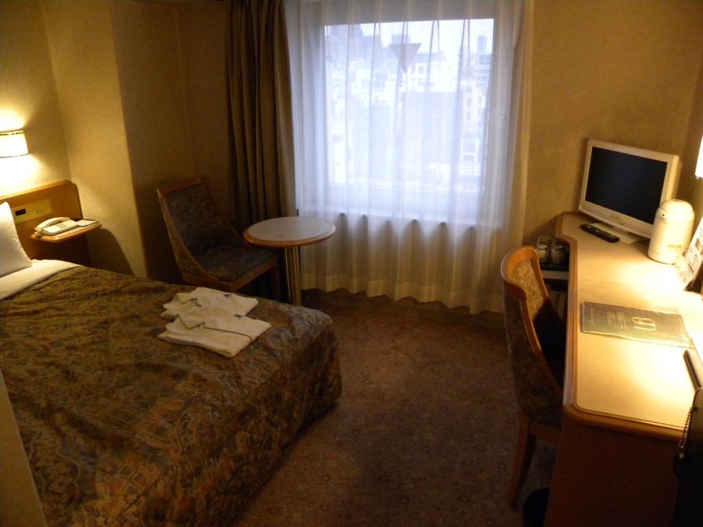 Postel nebo postele na pokoji v ubytování Hotel New Green Okachimachi