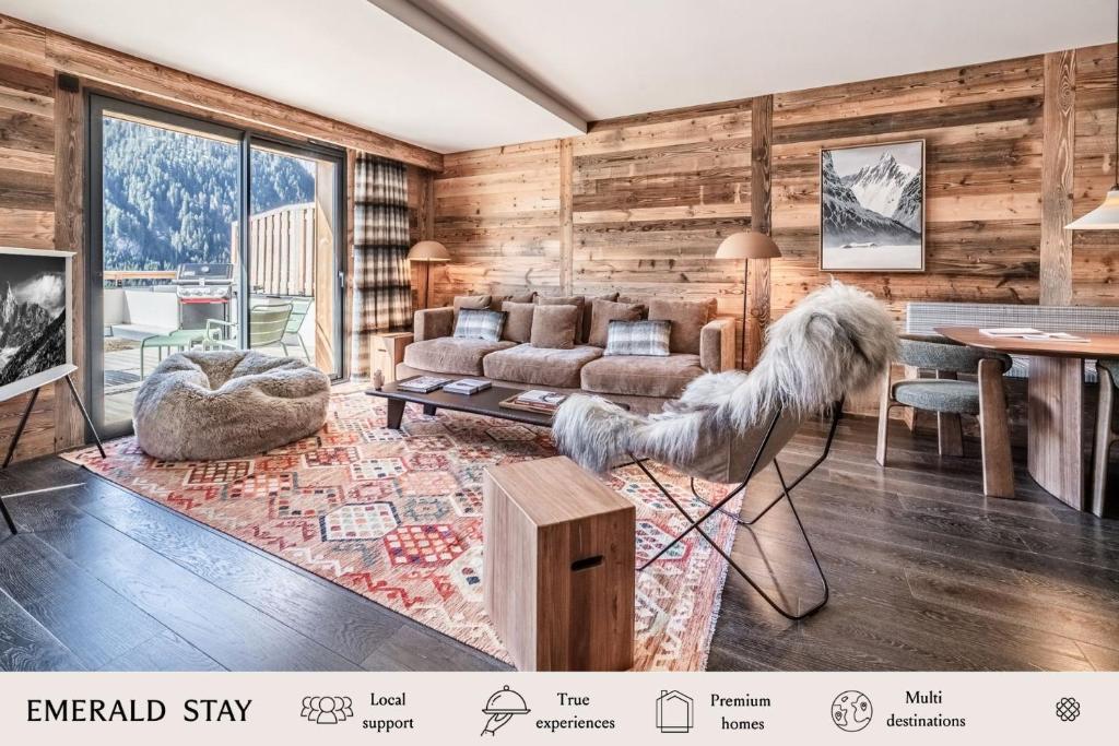 a living room with a couch and a table at Apartment Clano, Châtel - by EMERALD STAY in Châtel