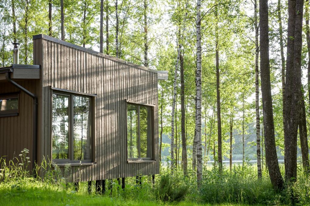 a house in the middle of a forest at Brīvdienu māja Empagi in Lādezers