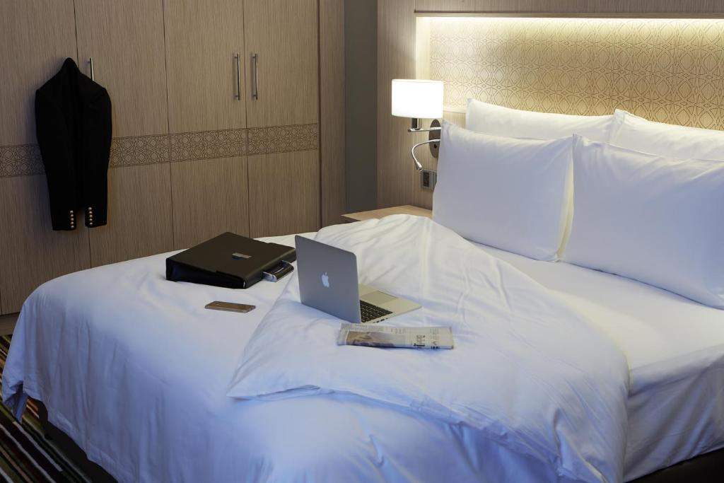 Postel nebo postele na pokoji v ubytování Dusit D2 Kenz Hotel Dubai
