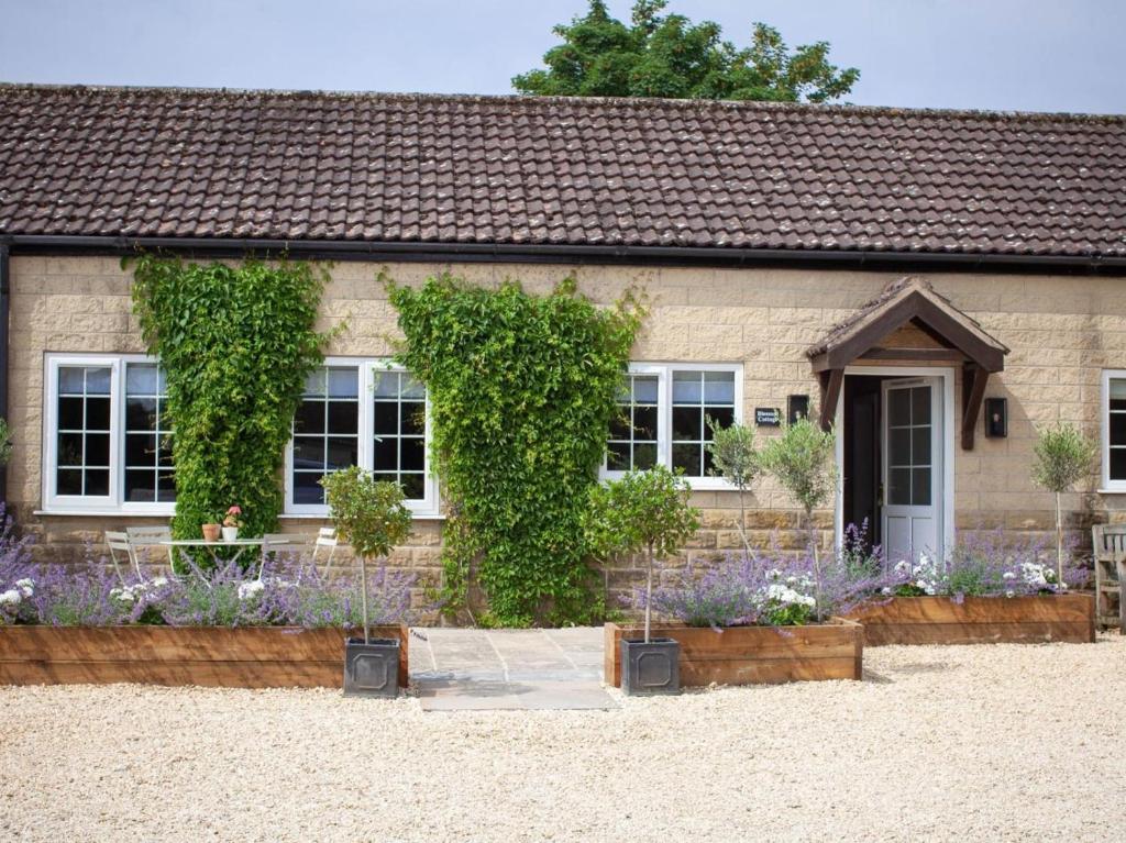 a house with flowers in front of it at 2 Bed in York oc-84001 in Crayke