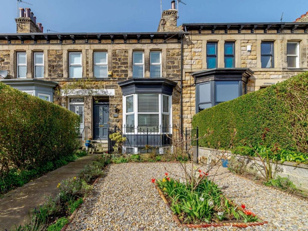 an old house with a garden in front of it at 3 Bed in Harrogate oc-hh056 in Harrogate