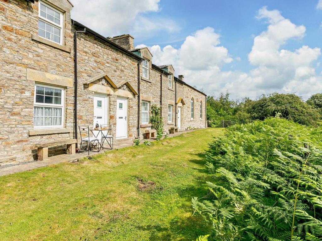 a row of brick houses with a yard at 2 Bed in Consett oc-92807 in Hunstanworth