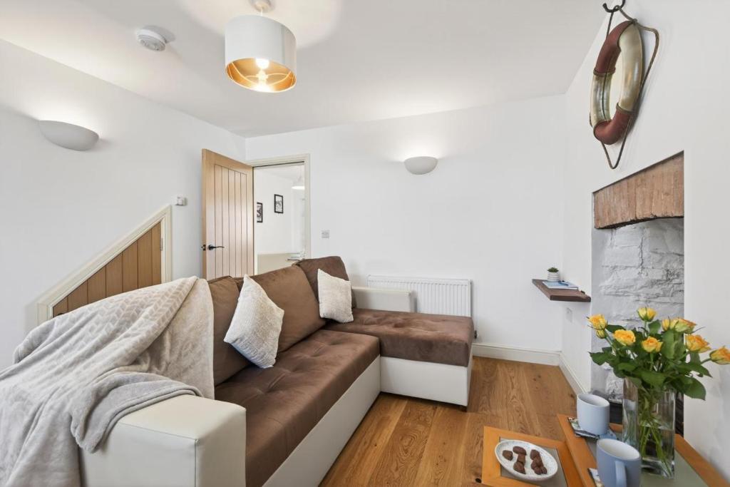 a living room with a couch and a fireplace at 2 Bed in Aberystwyth oc-c36918 in Aberystwyth