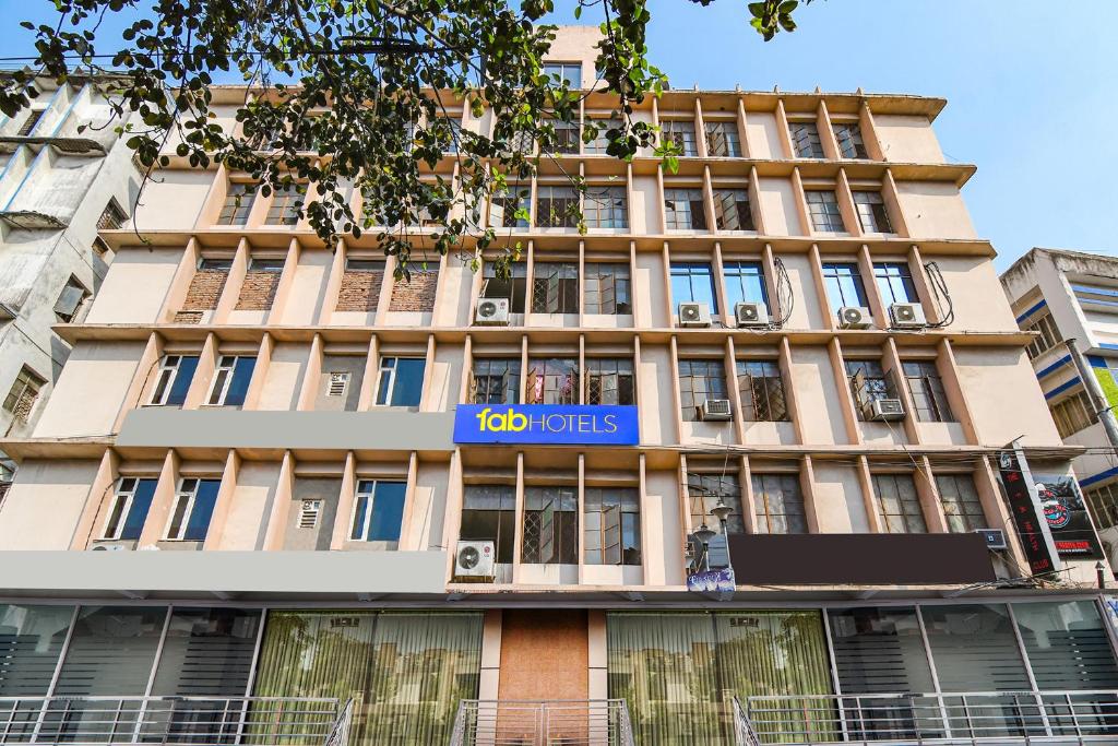 a building with a sign on the front of it at FabHotel Royal Park Inn - Nr Eden Garden Stadium in Kolkata