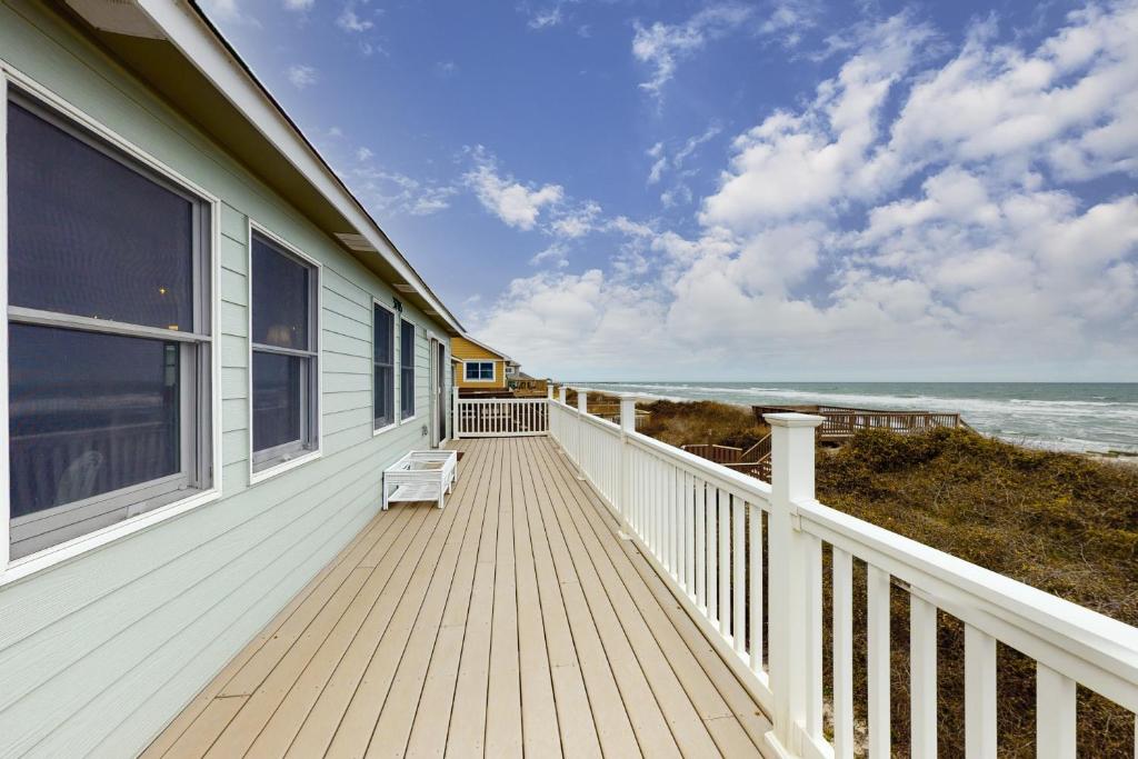 a porch of a house with a view of the ocean at Rylander-Timmerman House OBX in Nags Head