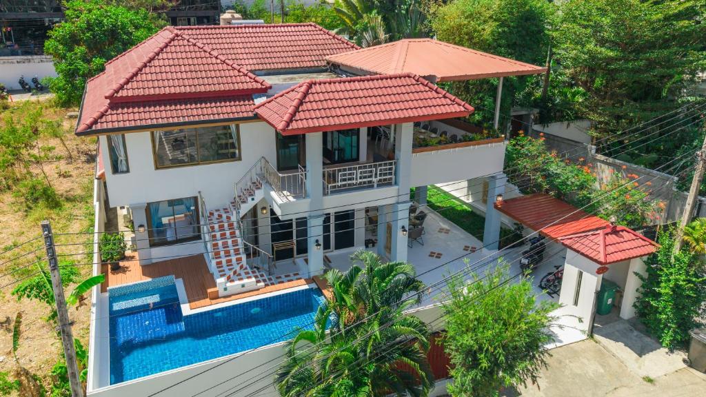 an aerial view of a house with a swimming pool at Villa Natali between Rawai and Nai Harn in Rawai Beach