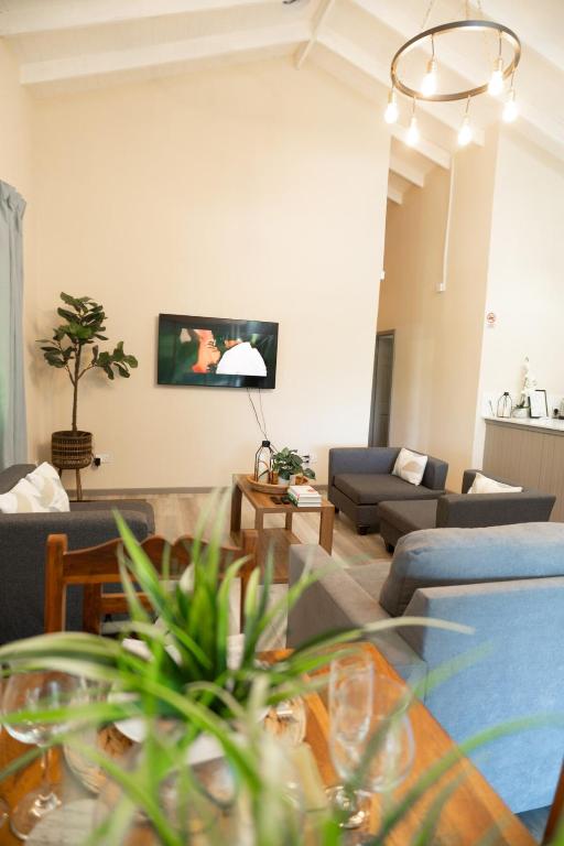 a living room with a couch and a table at Almond Tree Villa Beach Hideaway with Jacuzzi in Gros Islet