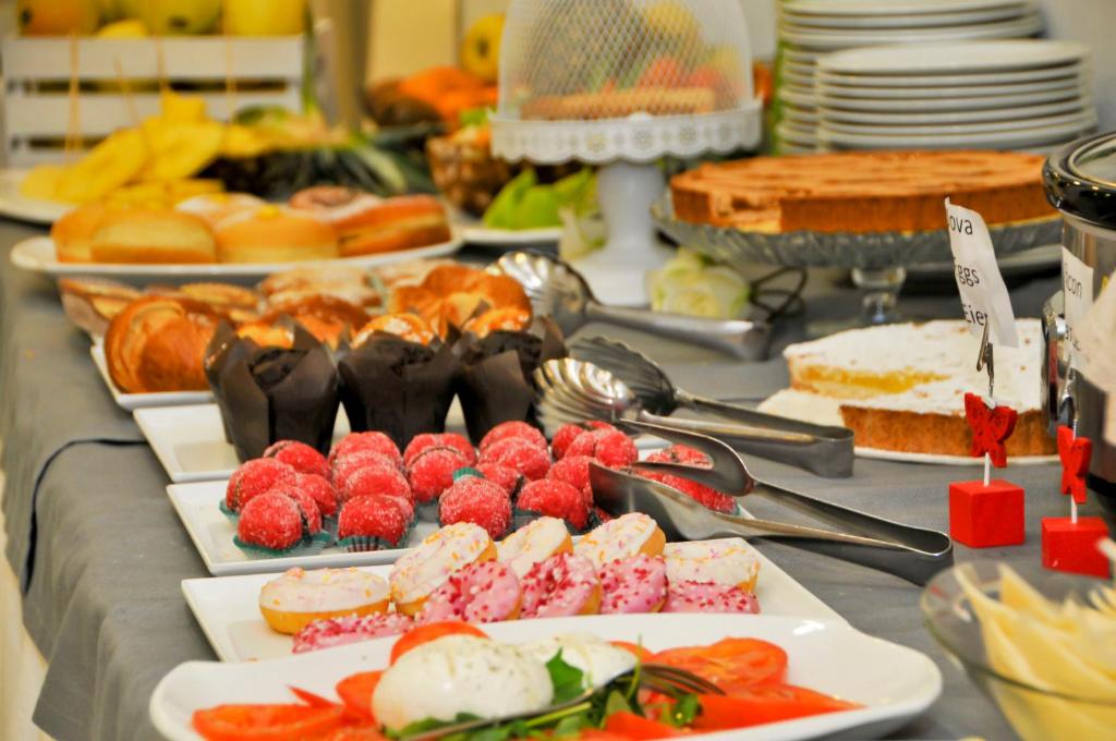 a table with many different types of food on it at Hotel Venezia in Caorle