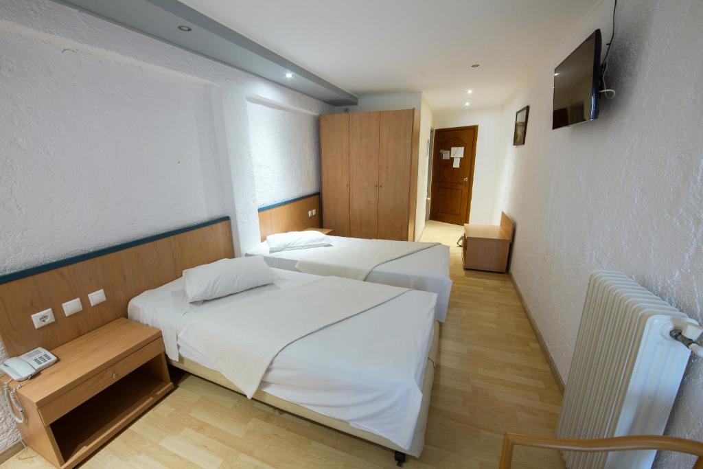 Postel nebo postele na pokoji v ubytování Thomas Beach Hotel