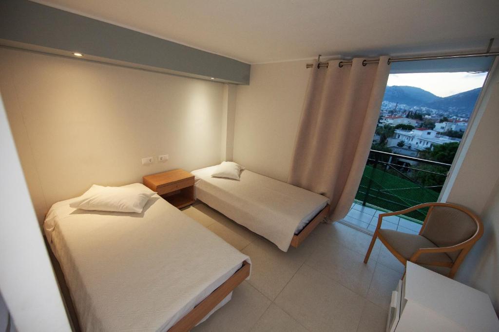 Postel nebo postele na pokoji v ubytování Thomas Beach Hotel