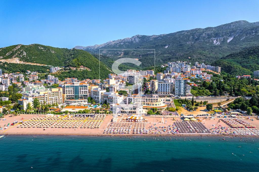 an aerial view of a beach with buildings and the ocean at Status-M Apartments 112 in Bečići