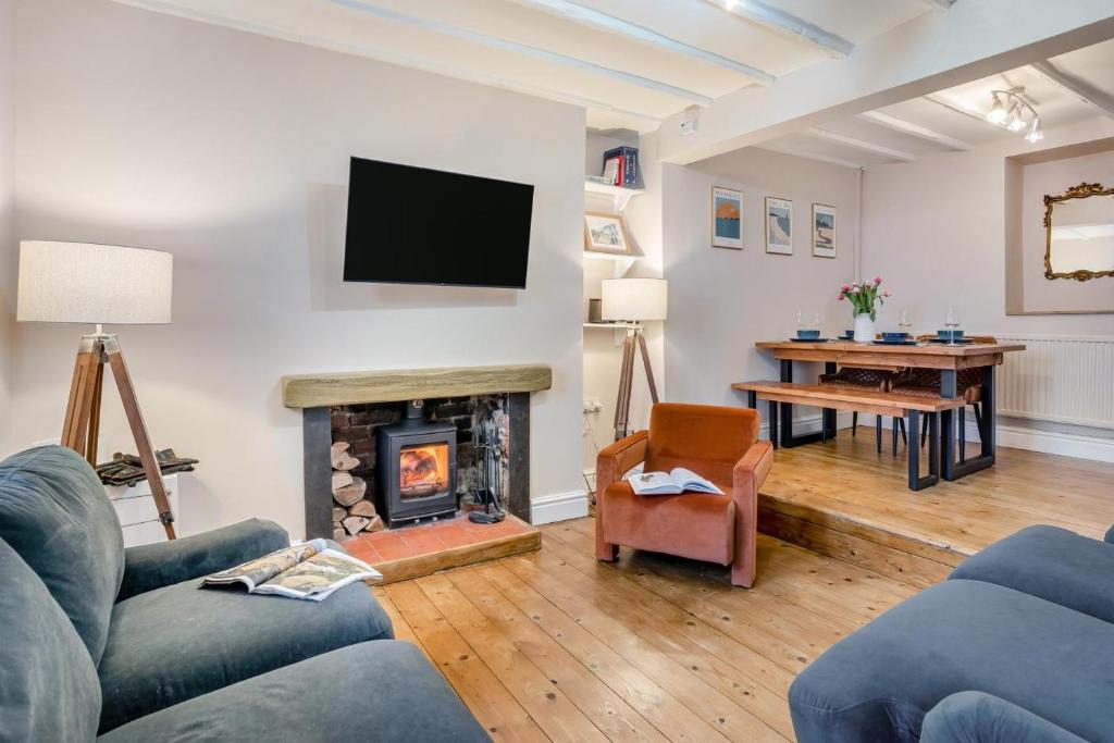 a living room with a fireplace and a tv at 2 Bed in Mumbles oc-v30980 in The Mumbles