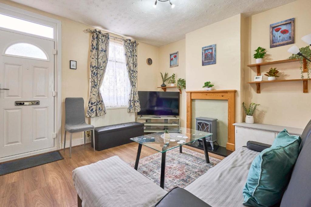 a living room with a couch and a table at Host & Stay - Dover Retreat in Ipswich