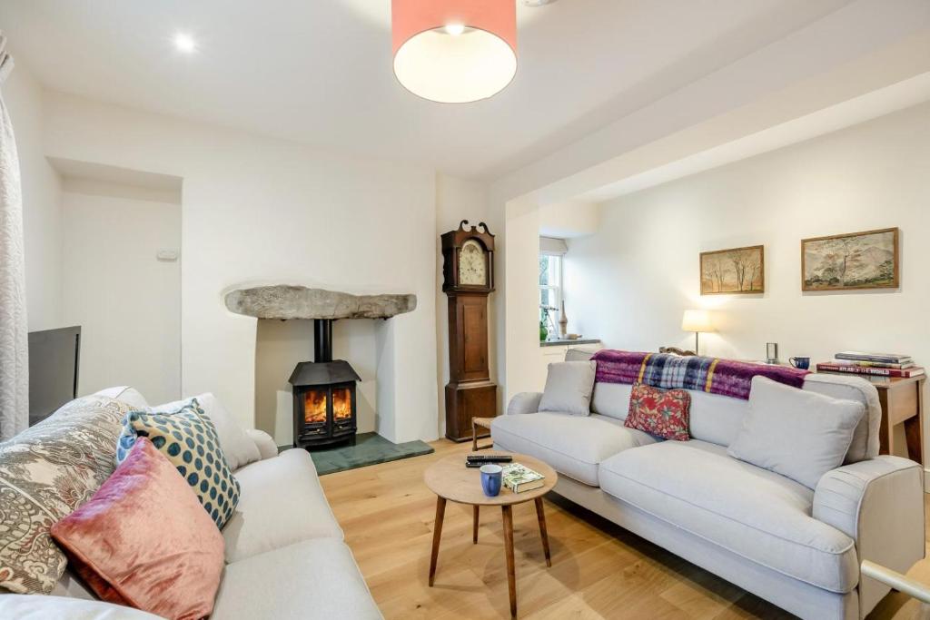 a living room with a couch and a fireplace at 5 Bed in Ulpha oc-b32731 in Ulpha