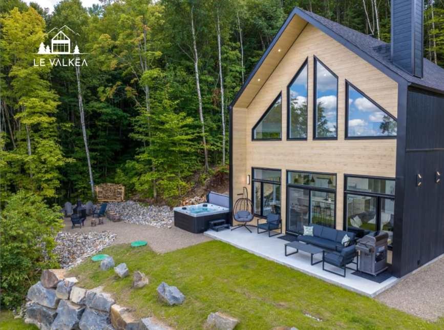 an image of a house with a garden at Chalet Le Valkea - Spa & Mountain in Saint Come