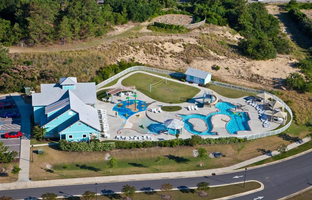 an aerial view of a resort with a water park at Just Peachy VillageOBX in Kill Devil Hills
