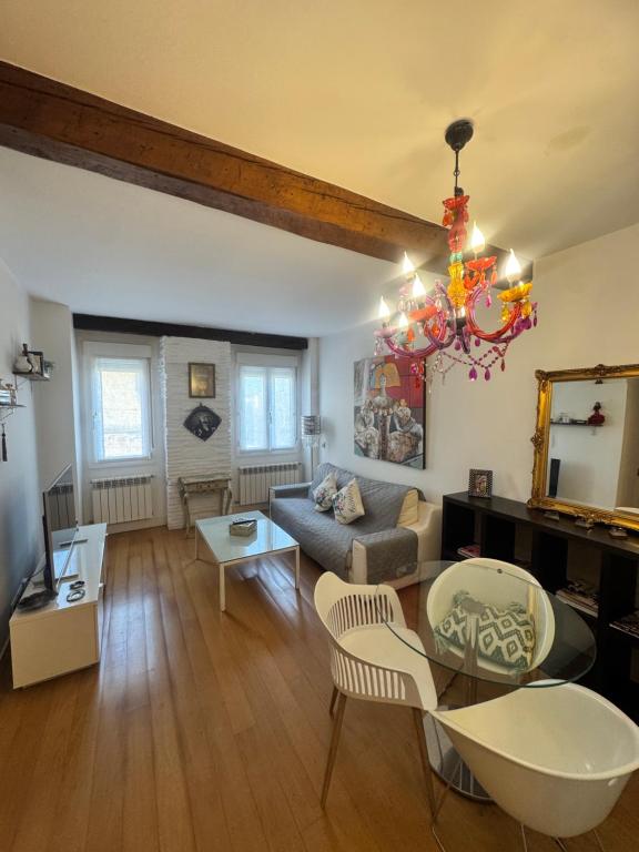 a living room with a couch and a table at Sagasta Centro in Logroño