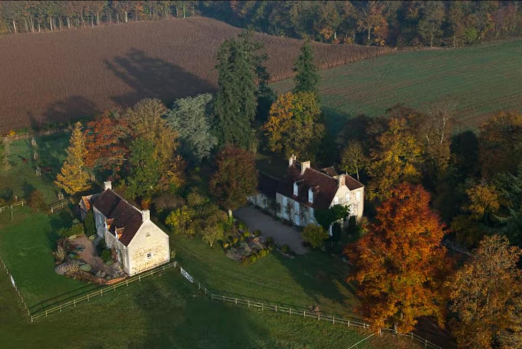 an aerial view of a large house in a field at Manoir de Pincelu in La Courbe
