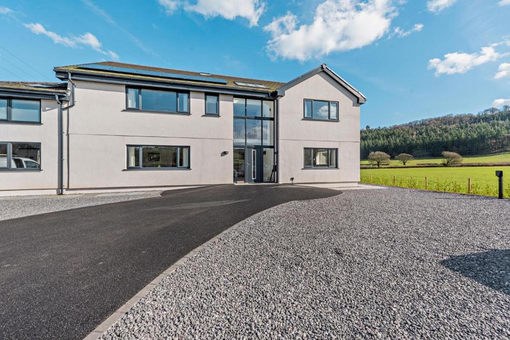 an image of a house with a driveway at 6 Bed in Llanarthney oc-c28878 in Llanarthney