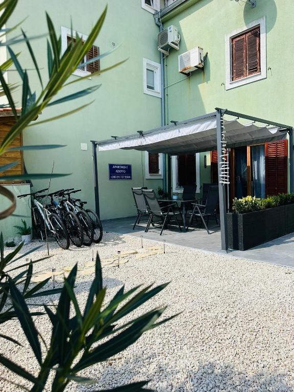 a group of bikes parked next to a building at Apartment ADEPTO in Sveti Jakov