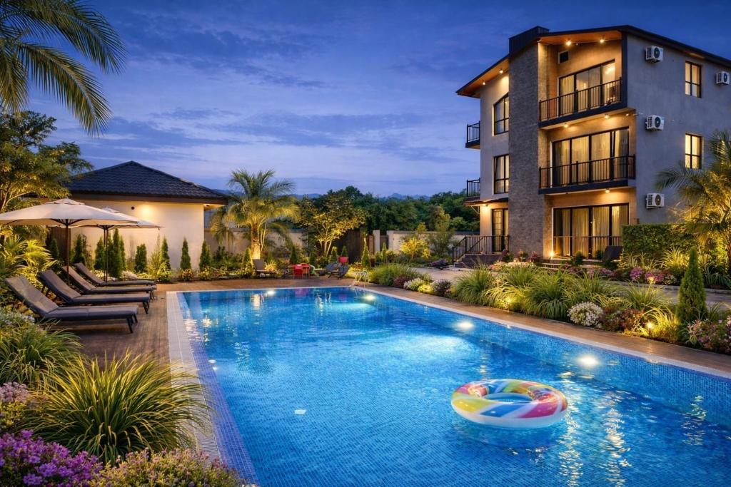 a pool in front of a house with a boat in it at Villa Feel Georgia in Batumi