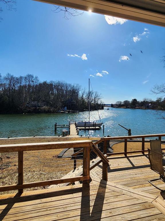 a wooden deck with a view of a lake at Creekside Oasis in Lusby