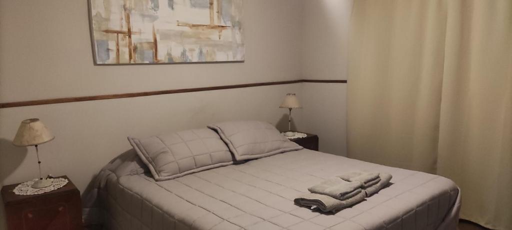 a bedroom with a bed with a towel on it at Lahogareña in La Cieneguita