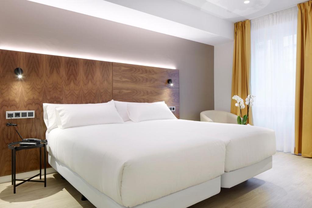 Postel nebo postele na pokoji v ubytování Hotel Arrizul Congress