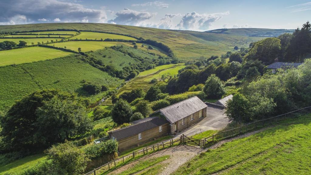 an aerial view of a barn in a green field at Hillway Lodge Withypool in Withypool