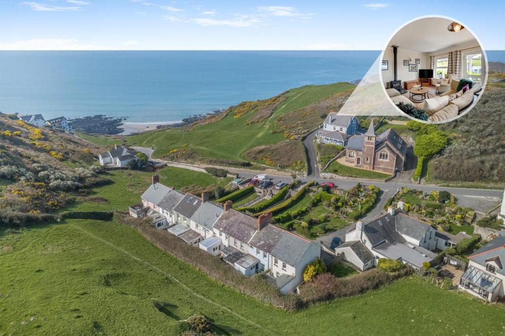 an aerial view of a house on a hill at 6 Bed in Mortehoe oc-hillcr in Mortehoe