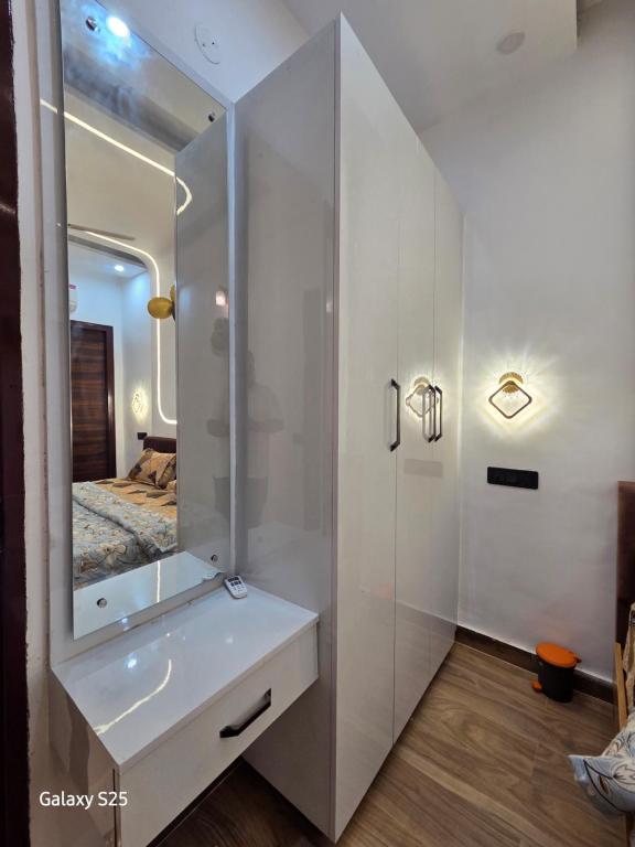 a bathroom with a sink and a mirror at Eknav Villa in Kharar