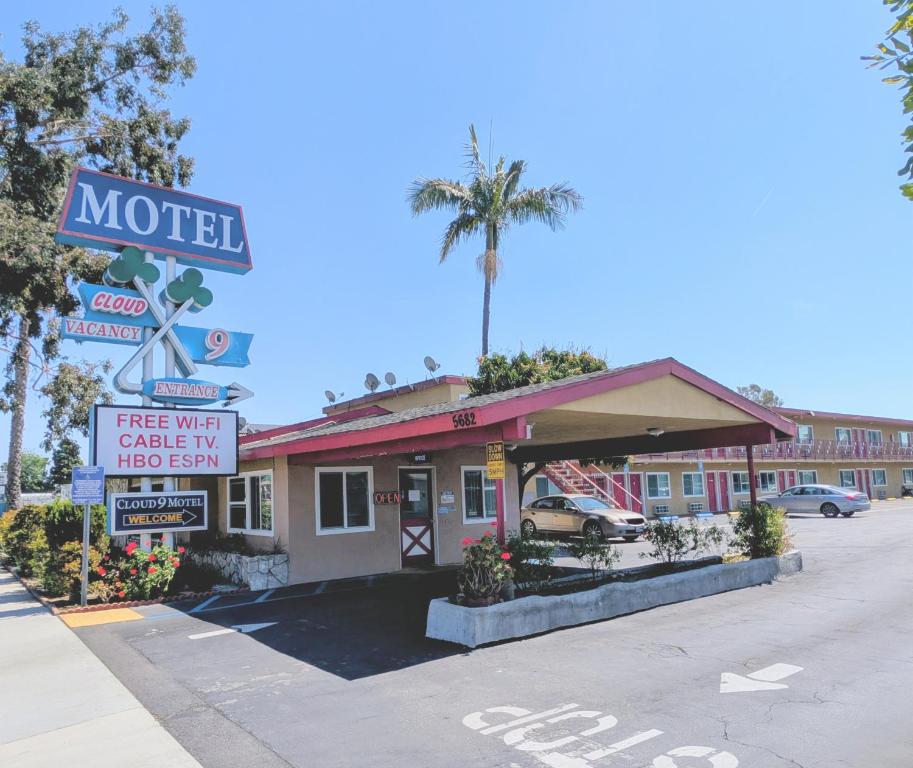 a motel with a sign in front of it at Cloud 9 Motel - Cypress, Buena Park in Cypress