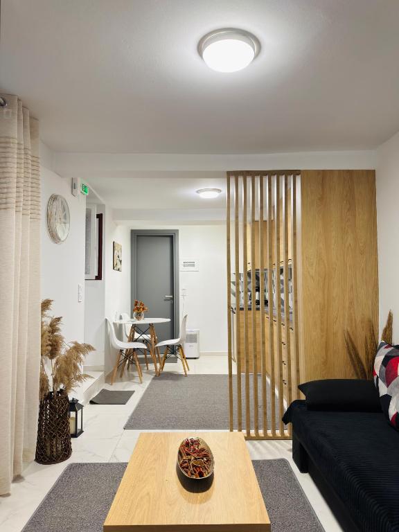 a living room with a couch and a table at The Central Retreat 1 in Mytilene