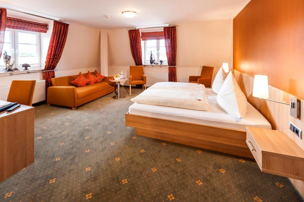 Postel nebo postele na pokoji v ubytování Hotel Hilker