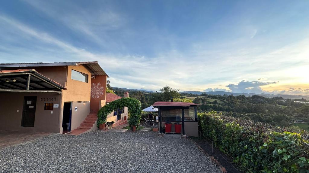a building with a view of a vineyard at Antara House in Guasca