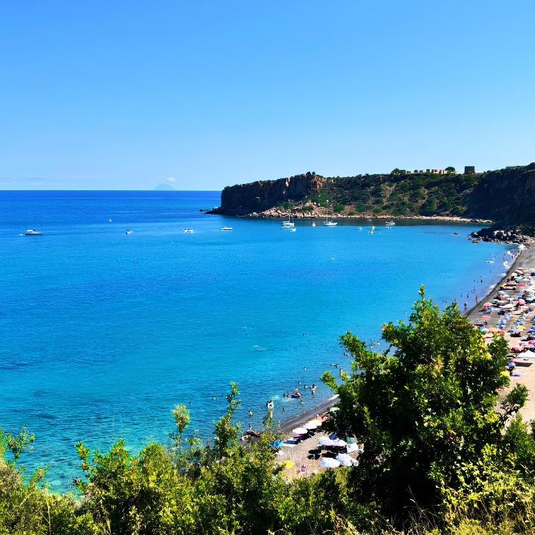 a view of a beach with people in the water at La Mya Aurora in Finale