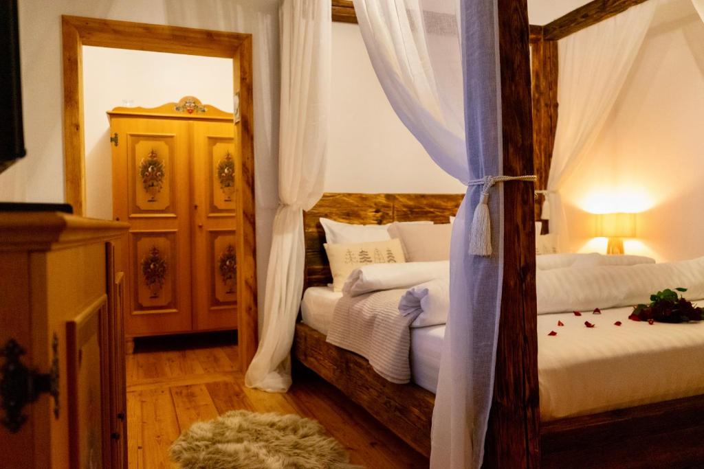 a bedroom with two beds and a mirror at Sadova Village - Casa Maria in Sadova