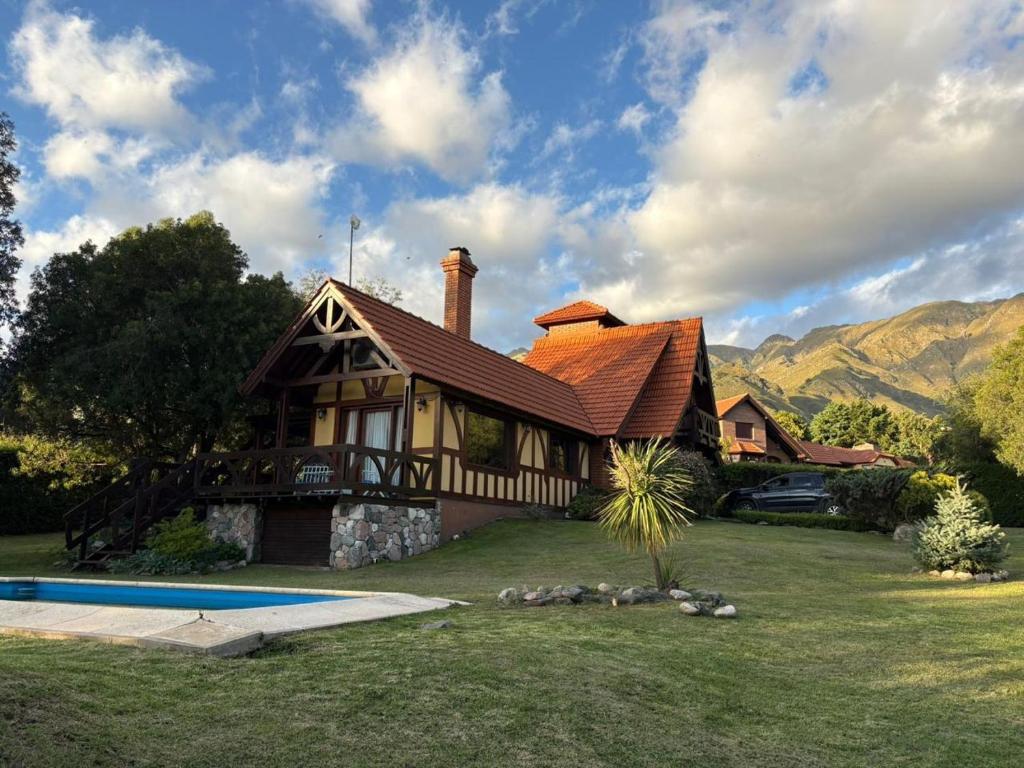 a house with a pool in front of it at Rincón del Cielo Country Club in Merlo