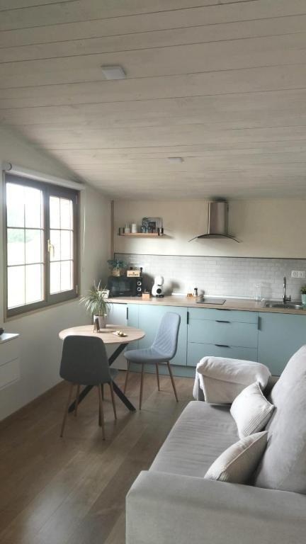 a living room with a couch and a table at Solapetxea Loft rural in Elosu