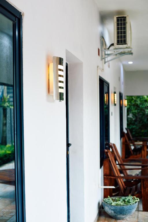 a door to a patio with a table and chairs at Chandamali Bed & Breakfast in Kitwe