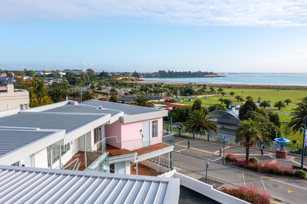 an aerial view of a city with the ocean at The Sea Breeze in Timaru