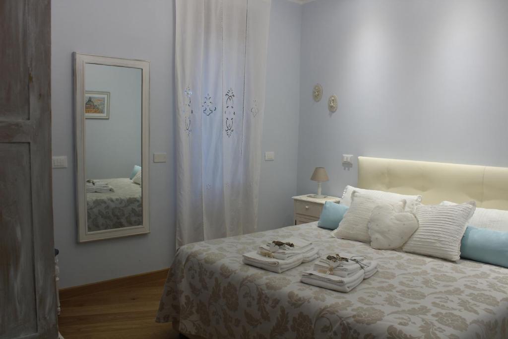 a bedroom with a bed with two towels on it at La Cupola Suite in Rome