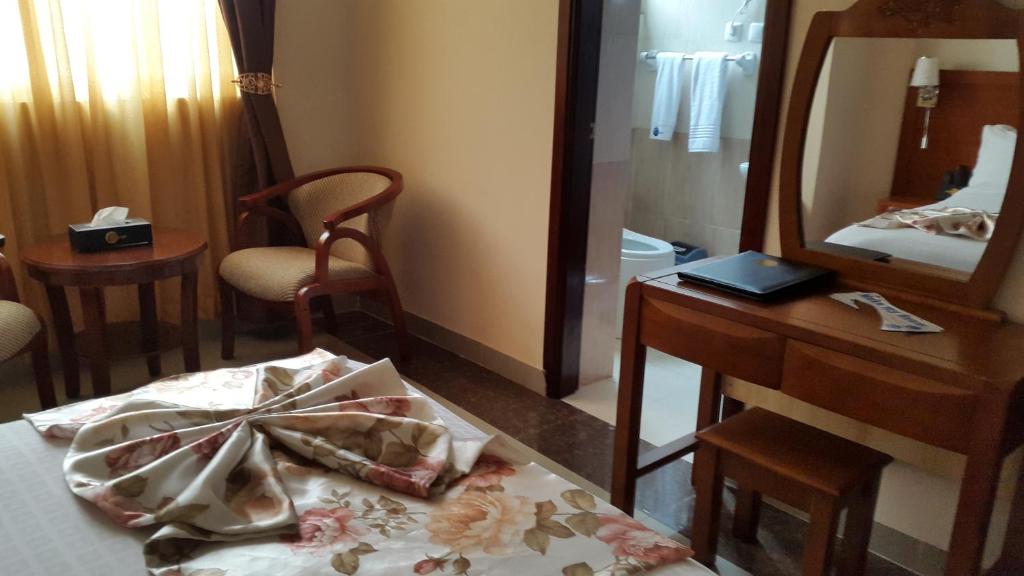 Postel nebo postele na pokoji v ubytování C Fun Addis Hotel