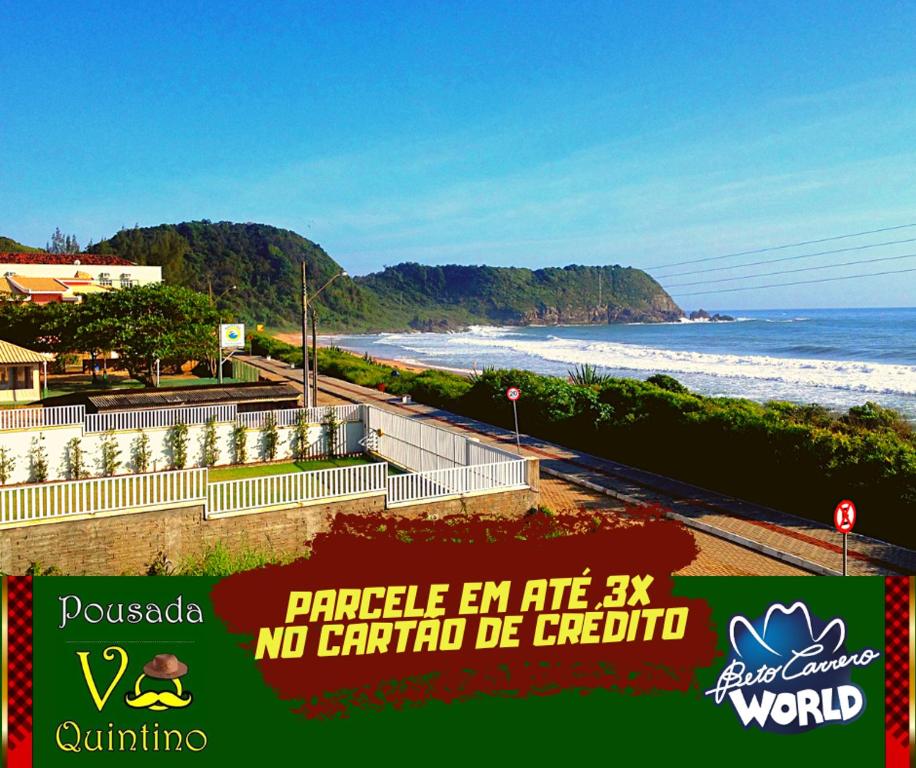 a view of a beach with the ocean at Pousada Vô Quintino in Penha